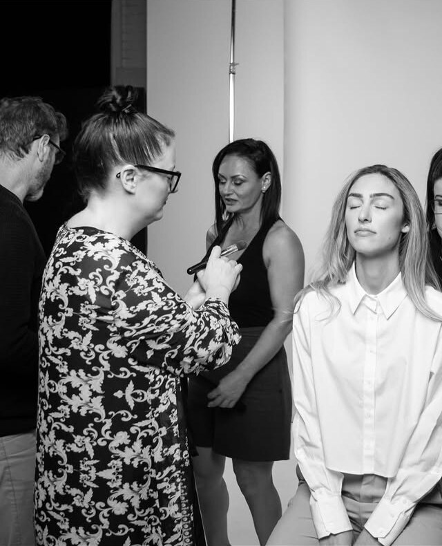 Backstage at a shoot, prepping models