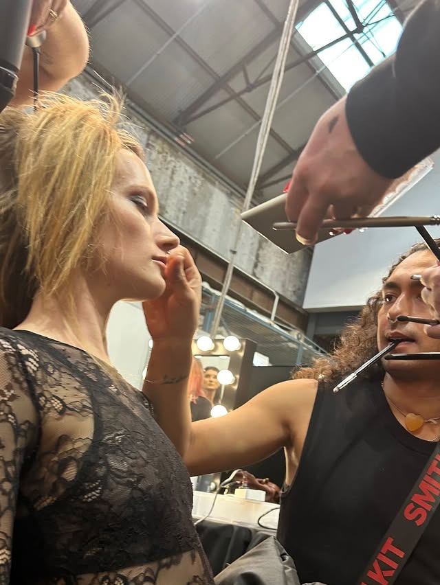 Backstage, hair and makeup in progress